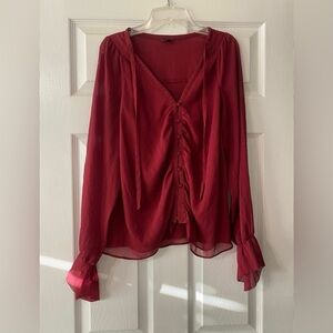 Guess Los Angeles long sleeve blouse is a size Small.